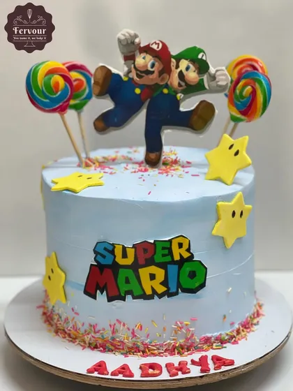 It's-a me, Mario! This Super Mario theme cake is bright, colourful, and fun, decorated with sprinkles and lollipops. It's a perfect centerpiece for a gaming-themed birthday party.