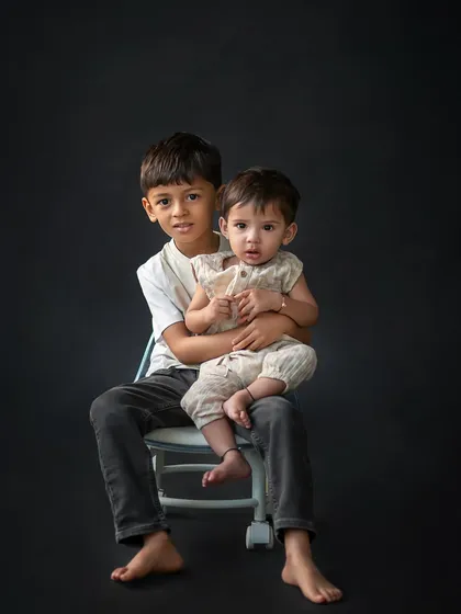 A simple, classic portrait of two brothers. Capturing the protective and gentle nature of an older sibling is always a heartwarming experience.