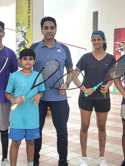 High-performance training sessions involve tactical discussions and on-court application. We use whiteboards to break down strategies and then immediately drill those patterns on the court.