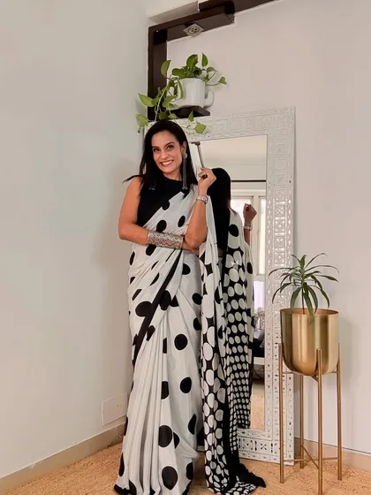 A classic black and white polka dot saree is a timeless choice for the office. It's chic, playful, and always looks professional.