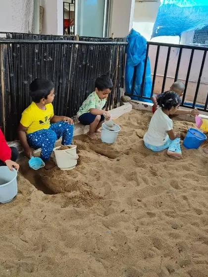 The sandpit is one of our most valuable outdoor classrooms. Here, children engage in sensory exploration and imaginative play, all while developing social skills like sharing and cooperation. It's a space for physical work, creative thinking, and joyful learning.