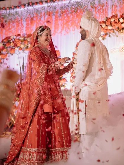 The joy of the Jaimala ceremony is a moment to cherish forever. I created this beautiful floral backdrop to frame the couple's special exchange, with soft lighting and a shower of petals adding to the romance and magic of the occasion.