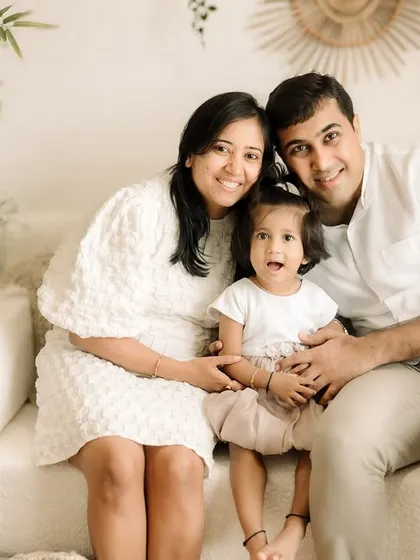 A happy, smiling family portrait. My studio's neutral, boho-inspired setup is perfect for timeless photos.