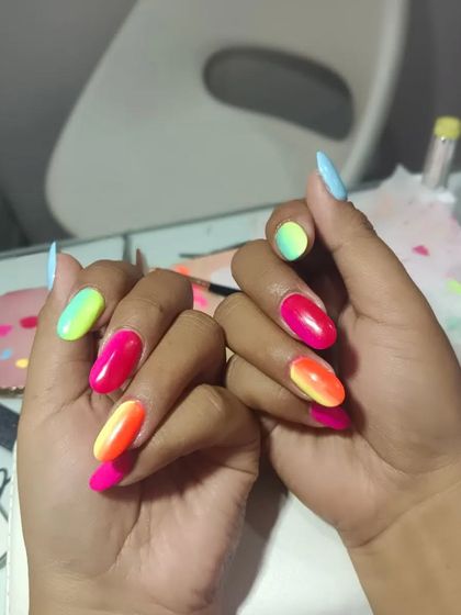 Neon ombré nails are perfect for making a statement. This set blends bright neon colors for a look that is pure energy and fun.