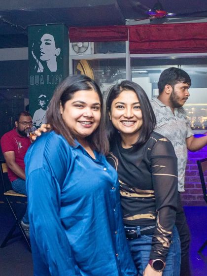 Two friends enjoying the cool atmosphere of the pub.