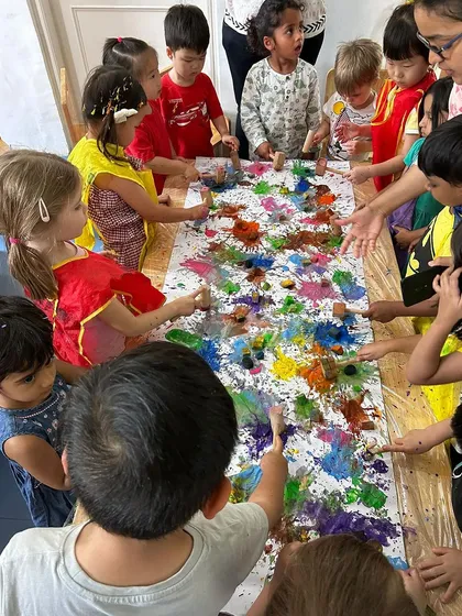 This collaborative art project during our Holi celebration shows the beauty of teamwork. The children worked together on a long canvas, dabbing and mixing colors to create a vibrant masterpiece, learning that creating together is just as fun as creating alone.