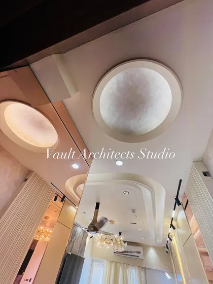 A look at the intricate false ceiling design in one of our projects. The layered circular and rectangular coves with concealed lighting add depth and architectural interest to the room.