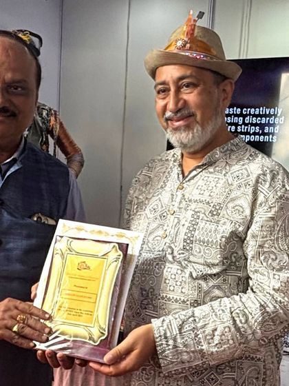 Here I am receiving an award, a moment of recognition for my dedication to the craft of upcycling. These honors motivate me to continue pushing the boundaries of sustainable art.