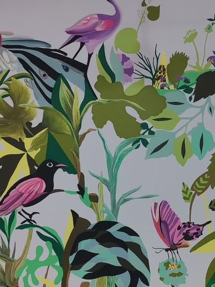 The full expanse of 'The Promised Land,' teeming with birds, butterflies, and lush foliage.