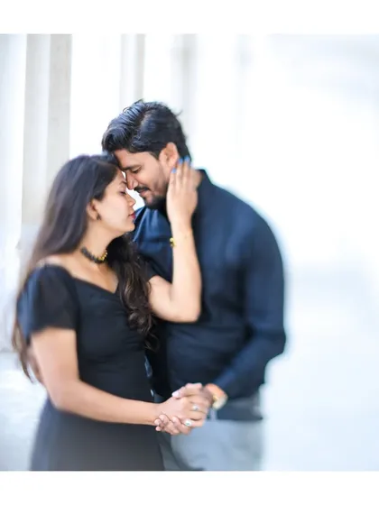 A soft-focus, intimate portrait of a couple in a tender embrace, highlighting their emotional connection.
