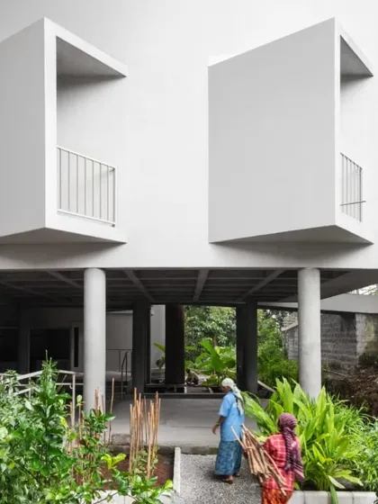 The ground level of the TAPMI Centre is lifted on stilts, creating a shaded, open-air corridor. This design choice makes the building feel light and allows for natural ventilation and uninterrupted movement across the site.