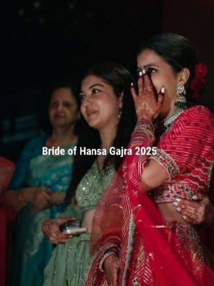 An emotional moment for the bride during her wedding. Her mehendi-adorned hand gently touches her face, capturing a feeling of love and sentimentality.