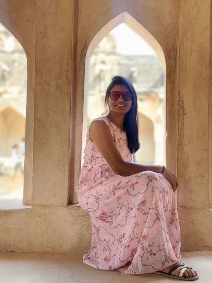 A moment of relaxation inside the Queen's Bath structure in Hampi.