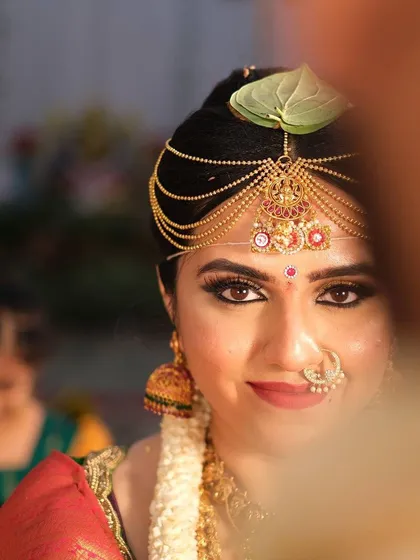A classic South Indian bridal look, focusing on radiant skin and captivating eyes. This is all about creating that timeless, elegant glow for your big day.