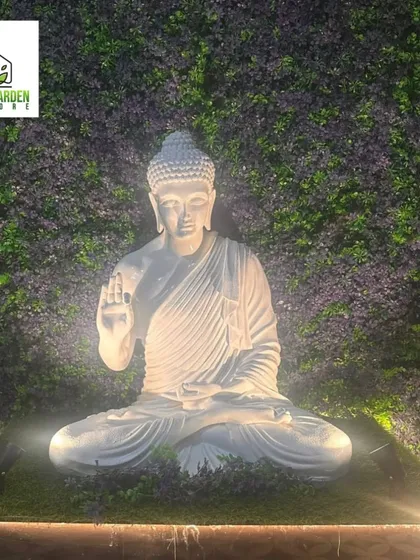 I love adding elements that bring peace and charm to a space. This beautifully lit Buddha statue, set against a custom purple and green foliage wall, creates a truly serene focal point.