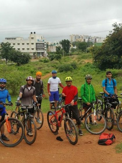 The group assembled on a dirt road, ready to begin or end a fantastic day of riding.