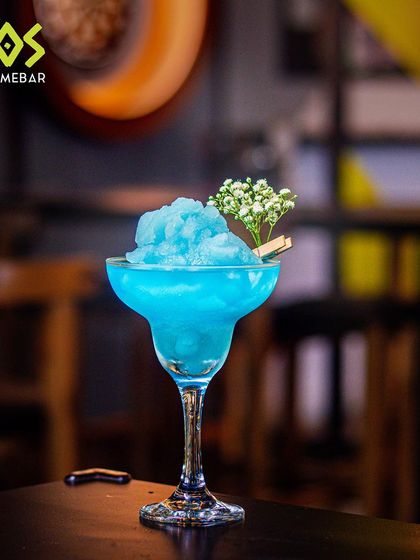 The 'Cooler Catch' cocktail from our T20 menu. A frosty blue slushy drink that's as cool as a catch on the boundary.