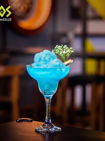 The 'Cooler Catch' cocktail from our T20 menu. A frosty blue slushy drink that's as cool as a catch on the boundary.