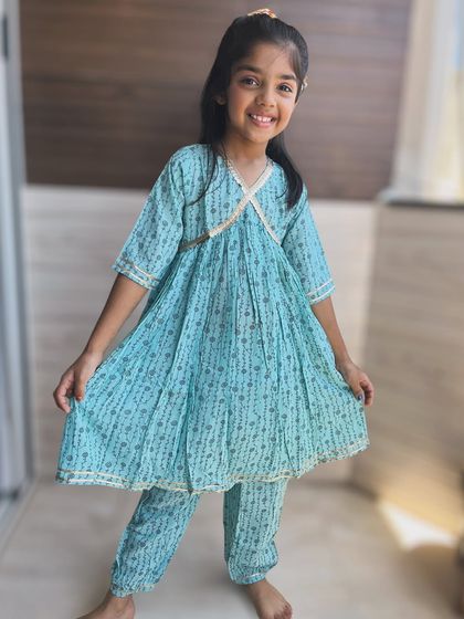This beautiful blue printed angarkha set is a great example of timeless elegance meeting playful comfort. It's a versatile piece that works for both special occasions and everyday fun.