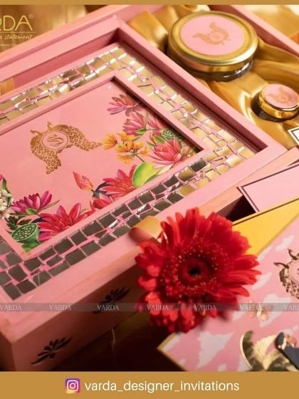 This lovely pink wooden box is decorated with a floral motif and a mirrored mosaic border. It's a perfect example of a bridal hamper, combining traditional design elements with a fresh, feminine color palette.