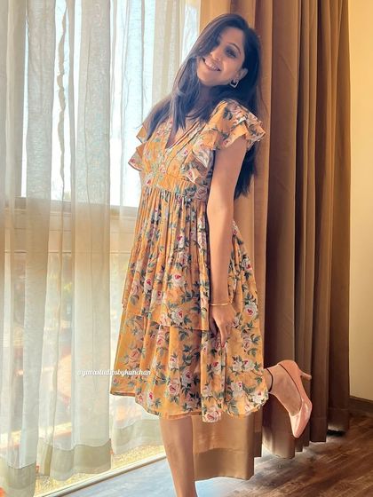 Another playful pose in the mustard yellow tiered dress. It’s a stunning piece that flows with grace and redefines elegance.