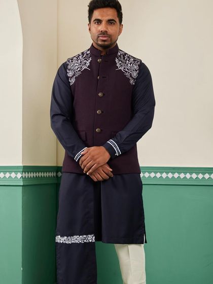 Our space blue bundi set, viewed from the front. The deep, rich colors are complemented by the striking silver embroidery on the shoulders, creating a look of understated luxury.