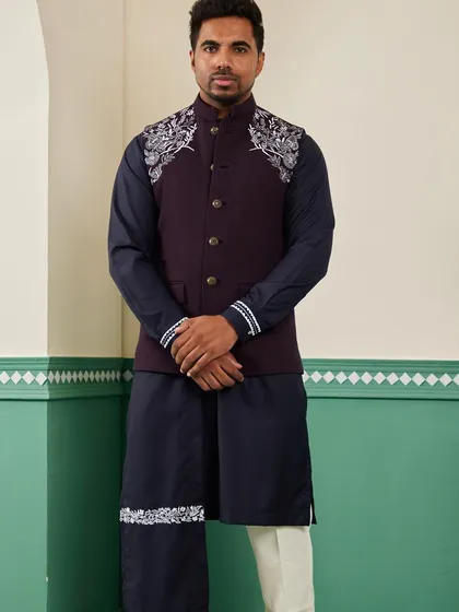 Our space blue bundi set, viewed from the front. The deep, rich colors are complemented by the striking silver embroidery on the shoulders, creating a look of understated luxury.