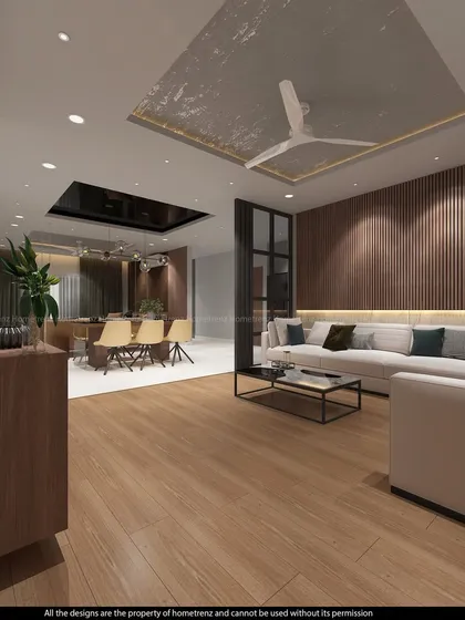 This drawing room uses dark wood paneling and a textured ceiling to create a warm and inviting atmosphere. The open layout connects it to the dining area, making it ideal for entertaining.