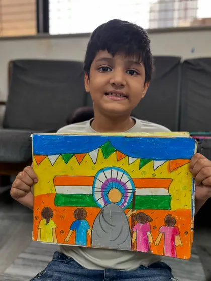 A 4th-grade student's Independence Day drawing featuring Mahatma Gandhi and the Indian flag, a tribute to our nation's history.