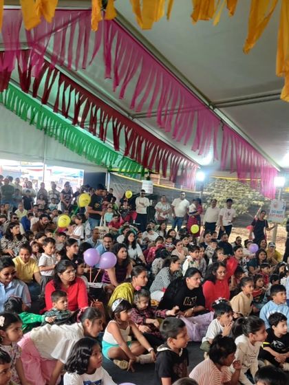 A view of the massive, enthusiastic crowd at one of our festival performances. The tent is packed with children and parents, all completely engaged in the show. It's an incredible feeling to connect with so many families at once.