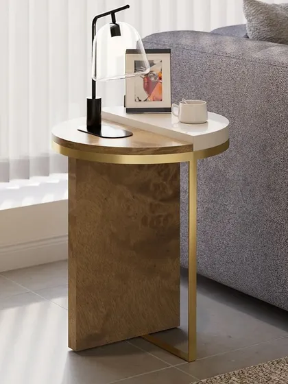 This side table features a unique split-top design, with one half in white lacquer and the other in a characteristic tree burl veneer. The piece is supported by a sleek stainless steel frame, making it a colorful and versatile addition to your home.