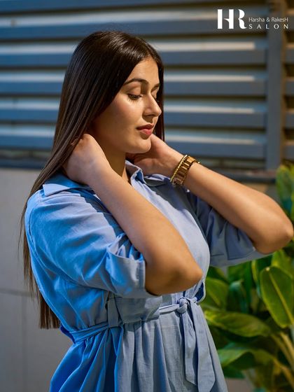 A client looking flawless and confident with her sleek, healthy hair after a treatment and style.