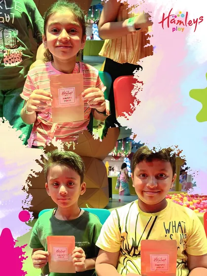 So many happy faces and colorful hands! These kids are proudly showing off the organic Holi colors they crafted during our special workshop. It’s a memory they can hold onto.