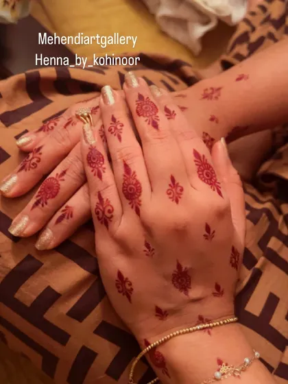 The rich, developed stain of a scattered floral pattern. This demonstrates the beautiful final color of my organic henna.