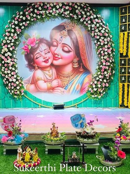 This stunning baby shower setup features a large, artistic backdrop of a mother and child. My platter arrangements are designed to complement this beautiful centerpiece.