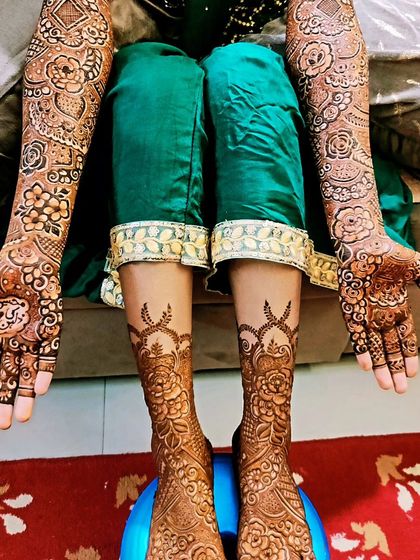The full bridal mehndi for this lovely bride, including detailed work on her hands and feet.
