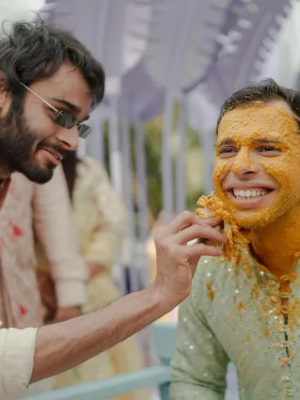 Another happy moment from the Haldi, where friends and family come together to celebrate with the groom.