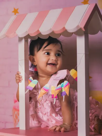 A sweet smile that's as delightful as ice cream. This close-up captures the pure joy of the moment.