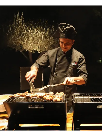 The aroma of live grilling under the stars adds a special warmth to any evening gathering. Our chefs expertly prepare succulent kebabs and grilled delicacies over open flame, providing both an engaging spectacle and perfectly cooked, smoky flavours for your guests to enjoy.