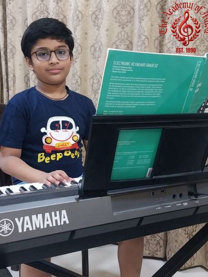 A double celebration for Abir Waigankar, who achieved a phenomenal 95 percent in his Grade 1 Electronic Keyboard exam and a near perfect 98 percent in his Grade 1 Theory of Music exam. What an outstanding start to his musical journey.
