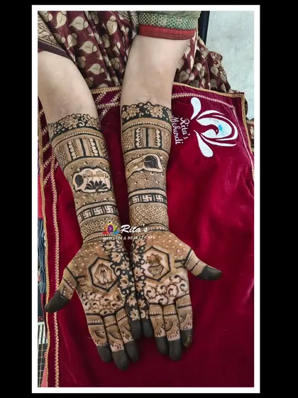 The daughter's mehendi, filled with symbols of Jainism like the lotus and auspicious motifs, representing her path to becoming a sadhvi.