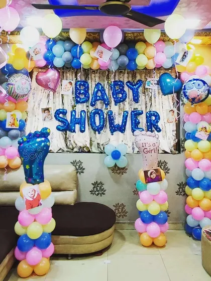 Another take on a baby shower decoration with pastel balloon pillars. This setup includes "It's a Boy" and "It's a Girl" foot-shaped foil balloons and can be personalized with baby photos.
