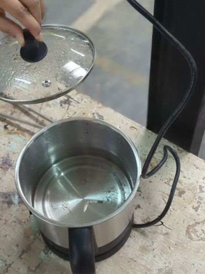 An essential step in the process: pickling. After being heated, the silver piece is placed in a warm acid bath to clean off oxidation and flux.