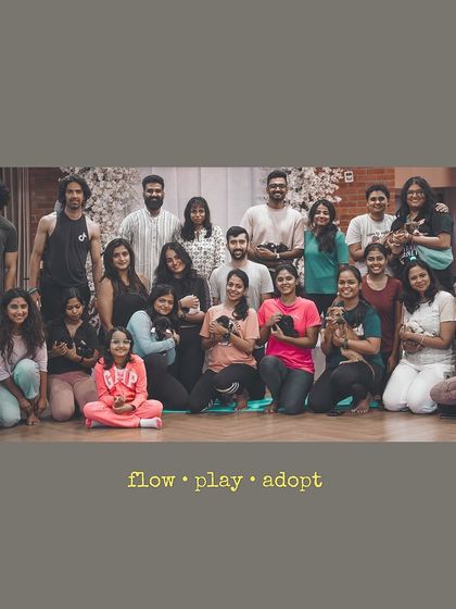 Flow, play, adopt. A group photo that perfectly encapsulates the three pillars of a Pawga event.