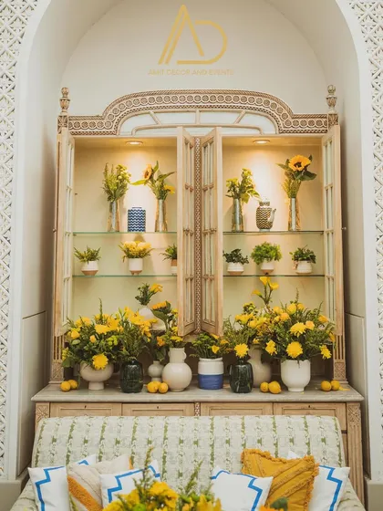 Details are everything. I filled this vintage-style cabinet with beautiful arrangements of yellow flowers and lemons, turning it into a stunning decorative feature.