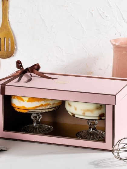 This twin-bowl gift set is perfect for sharing a sweet moment. It features my refreshing Mango Cream Cheese Trifle and the timeless Classic Tiramisu, elegantly presented in a window box.