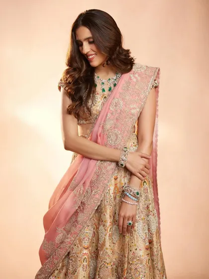 The full silhouette of this Anamika Khanna lehenga shows its graceful flow. It’s a beautiful option for anyone looking for a designer rental that is both elegant and timeless.