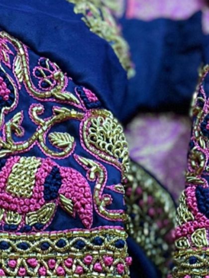 Close-up of the sleeve embroidery, showing the detailed craftsmanship of the elephant and bird motifs. I use a combination of techniques to give each design depth and character.