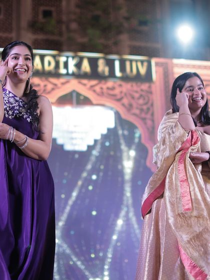 A dance performance at a friend's wedding. My one-shoulder purple draped dress is a modern and chic choice for a wedding guest, especially for a Sangeet or reception.