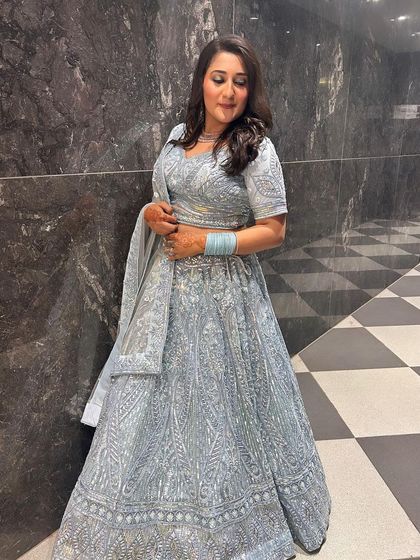 Obsessed with this powder blue chikankari-style lehenga. It's elegant, timeless, and perfect for a day function. A client is seen here looking absolutely lovely.